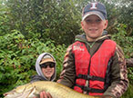 children with caught muskie fish