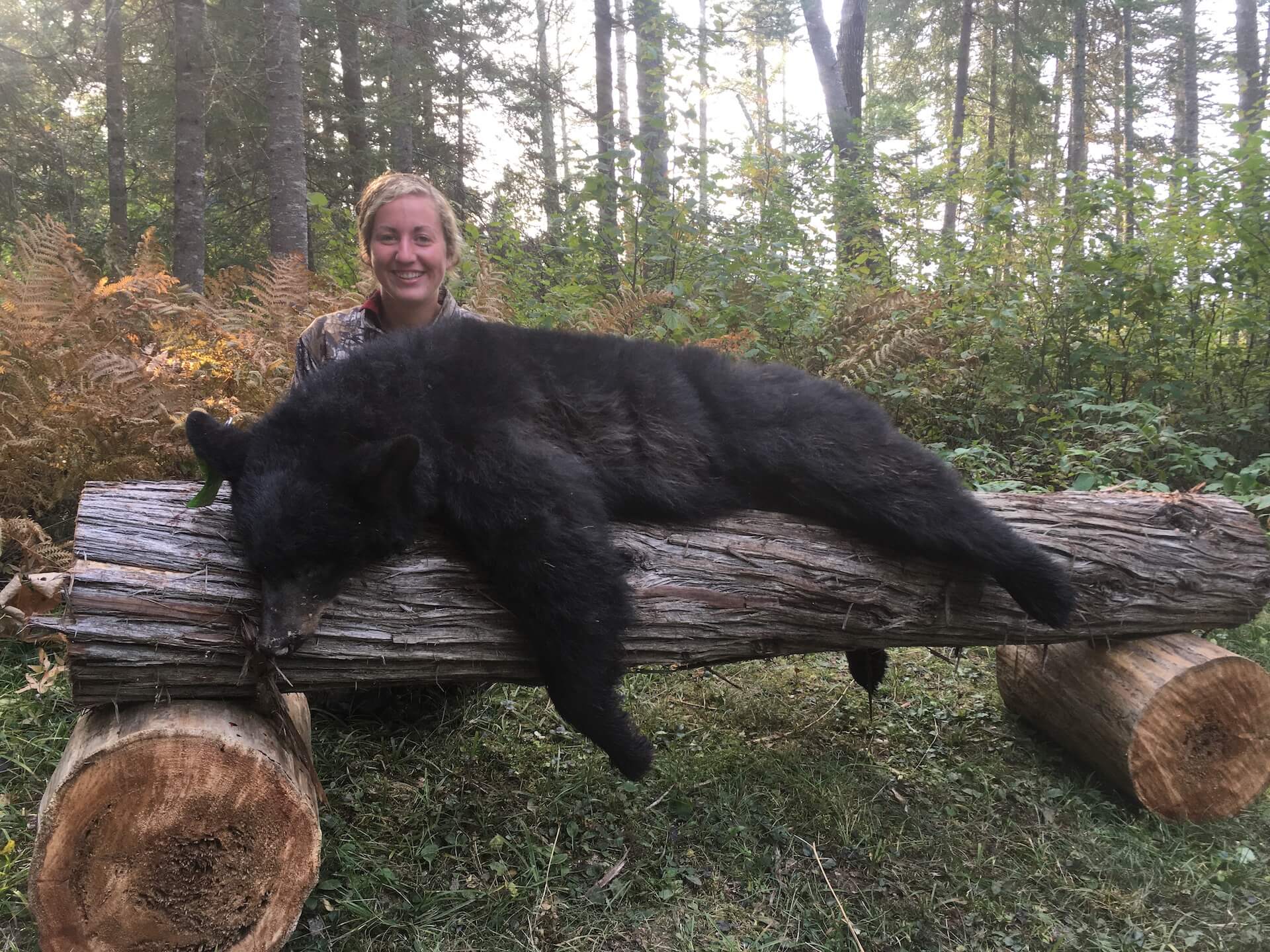 woman with caught black bear cub